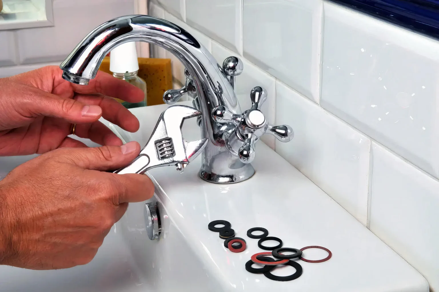 Plumber maintaining a bathroom faucet in Goleta