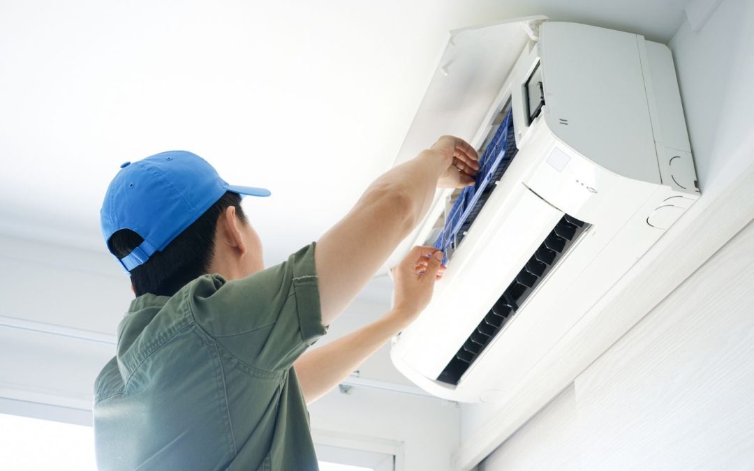 HVAC technician servicing a ductless mini split in Goleta